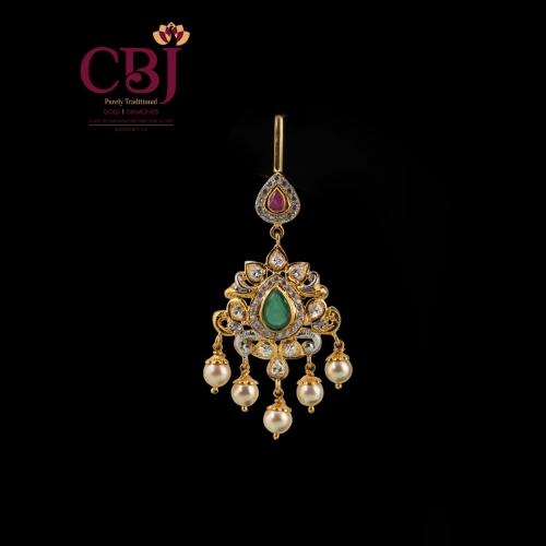 Simple traditional Maang tikka with CZ stones as the highlight.