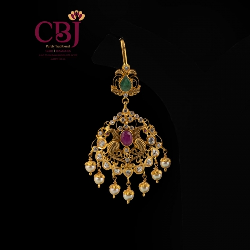 Antique Tikka featuring a peacock design, bejewelled with cz stones.