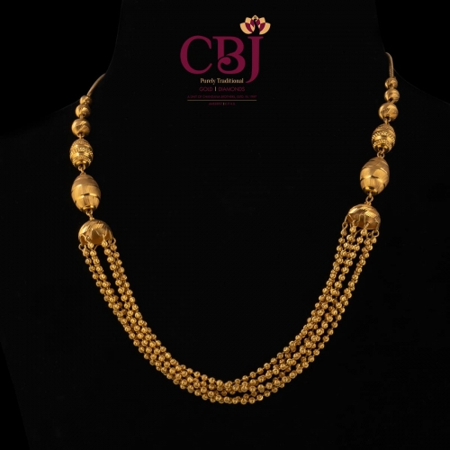 Bunch of gold balls strung together in a chain. A customary traditional wear.