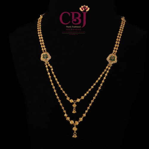 Simple 2 line chain necklace with 2 side pendants featuring a floral design.