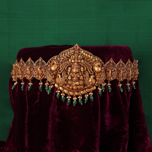 Antique Lakshmi Nakashi Vaddanam featuring peacock motifs suspended with emerald drops 