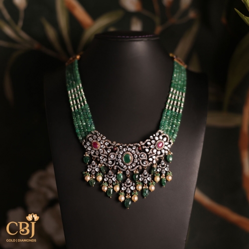 The epitome of sophistication, our Victorian necklace is crafted with shimmering CZ stones, emeralds and pearls.