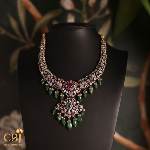 Enhance your style and make heads turn with this regal Victorian necklace featuring CZs, rubies and emerald drops.