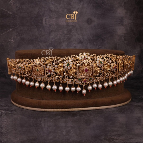 A slim CZ vaddanam decorated with pearls.