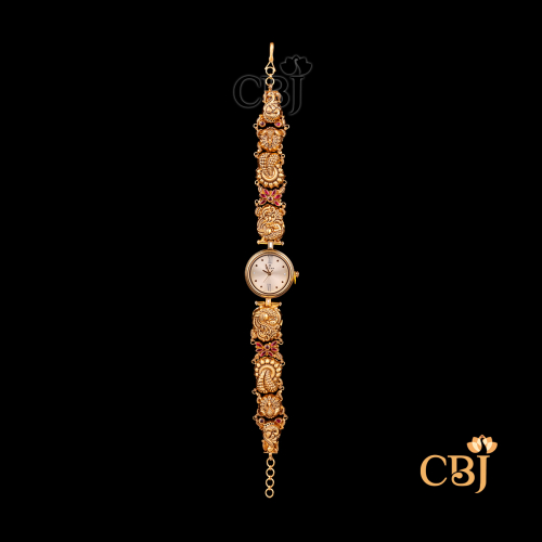 12 grams Nakshi Lightweight gold Watch Design shown as a gold wrist watch with carved Nakshi detailing on the strap and a polished gold finish around the dial.