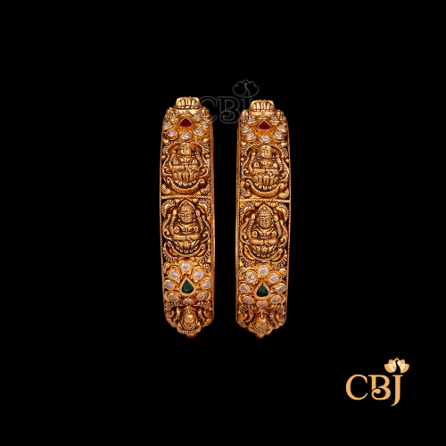 35 grams Nakshi Antique Bangles shown as a pair of gold bangles with detailed Nakshi carvings, antique texture, and a circular wrist shape.
