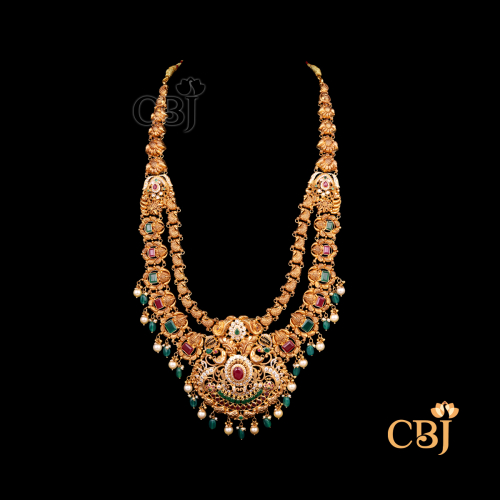 74 grams CZ pachi lightweight Long haram shown as a long gold necklace with CZ pachi stones, extended layered design, and detailed traditional work.