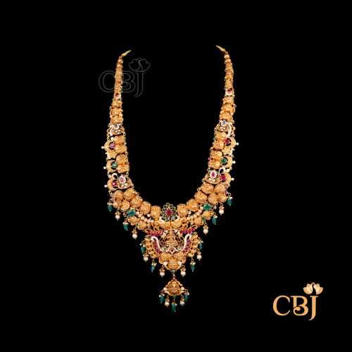 65 grams CZ pachi lightweight Long haram displayed as a long gold necklace with CZ stone work, extended length, and a flowing traditional design.