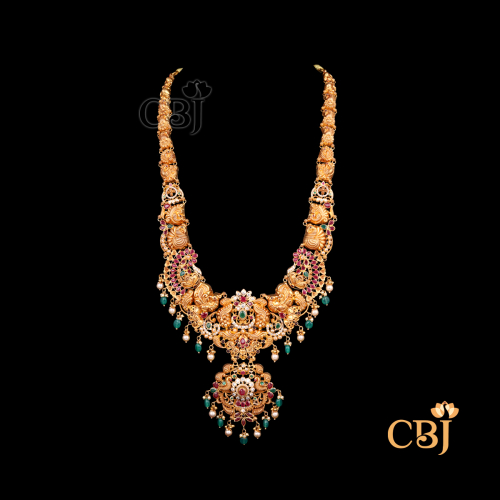 63 grams CZ pachi lightweight Long haram shown as a long gold necklace with sparkling CZ stones, extended layered design, and traditional styling.