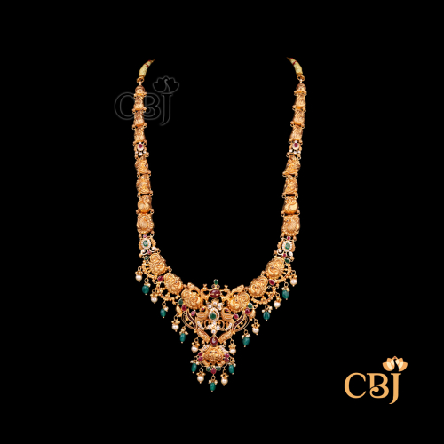 37 grams Long haram necklace shown as a long gold necklace with extended chain design, detailed patterns, and a traditional flowing style.