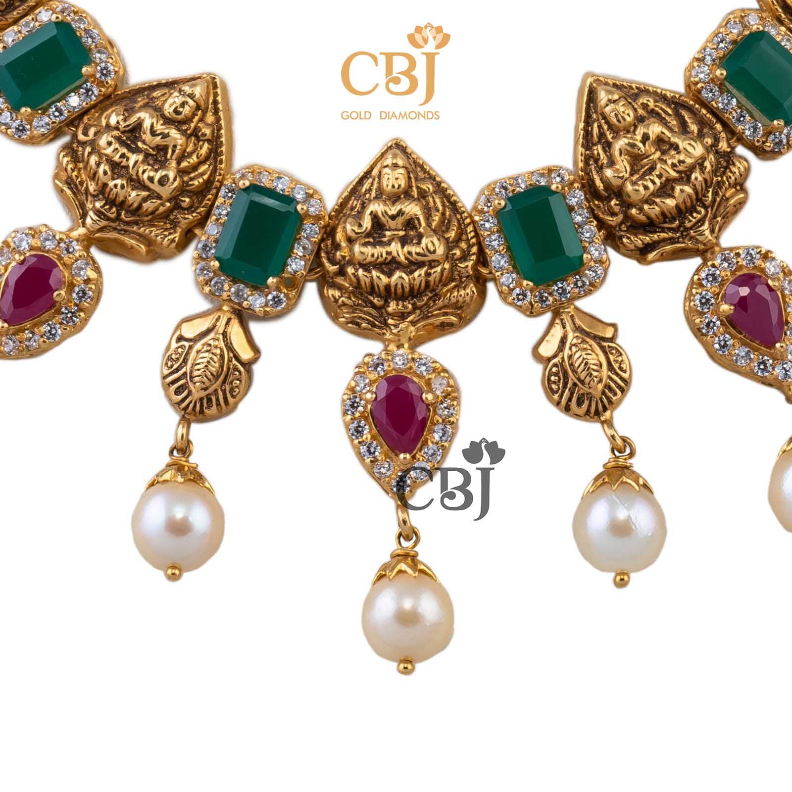 Antique short necklace featuring rubies, emeralds and pearls in perfect symmetry.