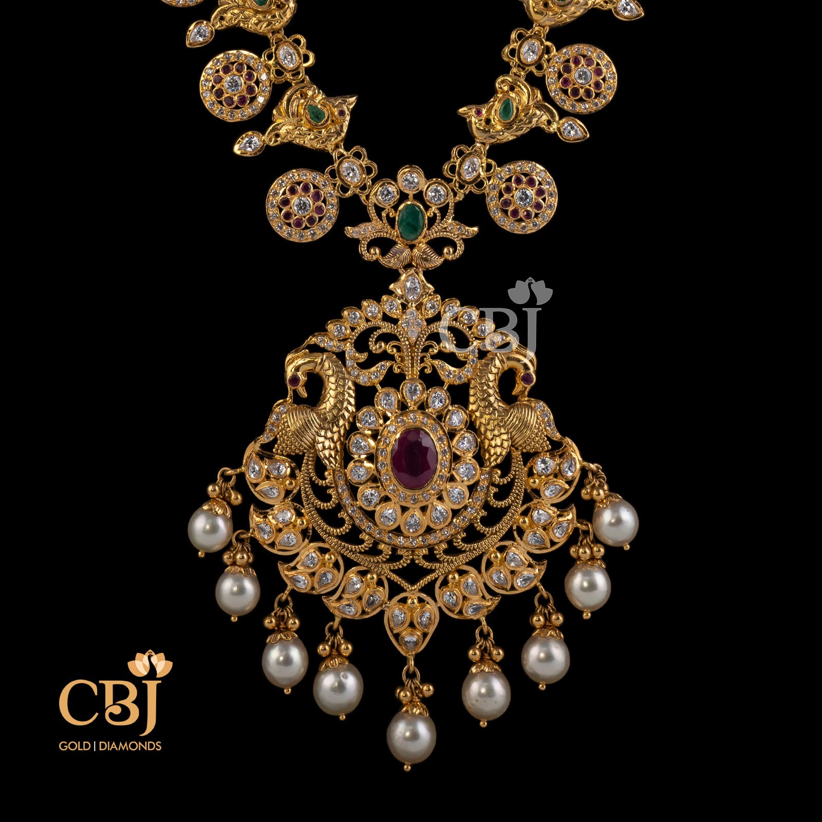 A traditional semi long CZ pachi bottumala featuring emeralds, rubies and pearls.