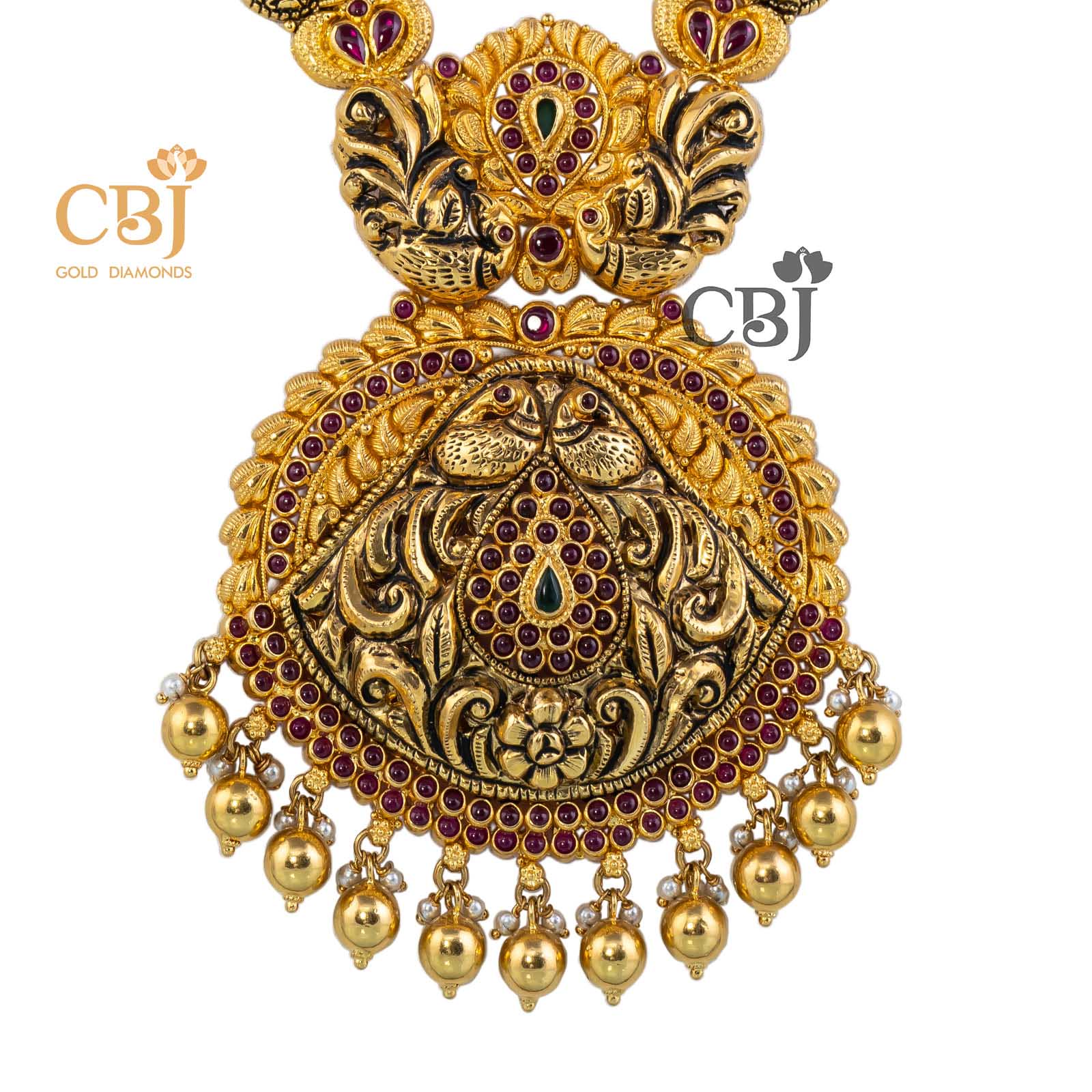 Antique light weight semi long haar featuring peacock motifs decorated with ruby potas.