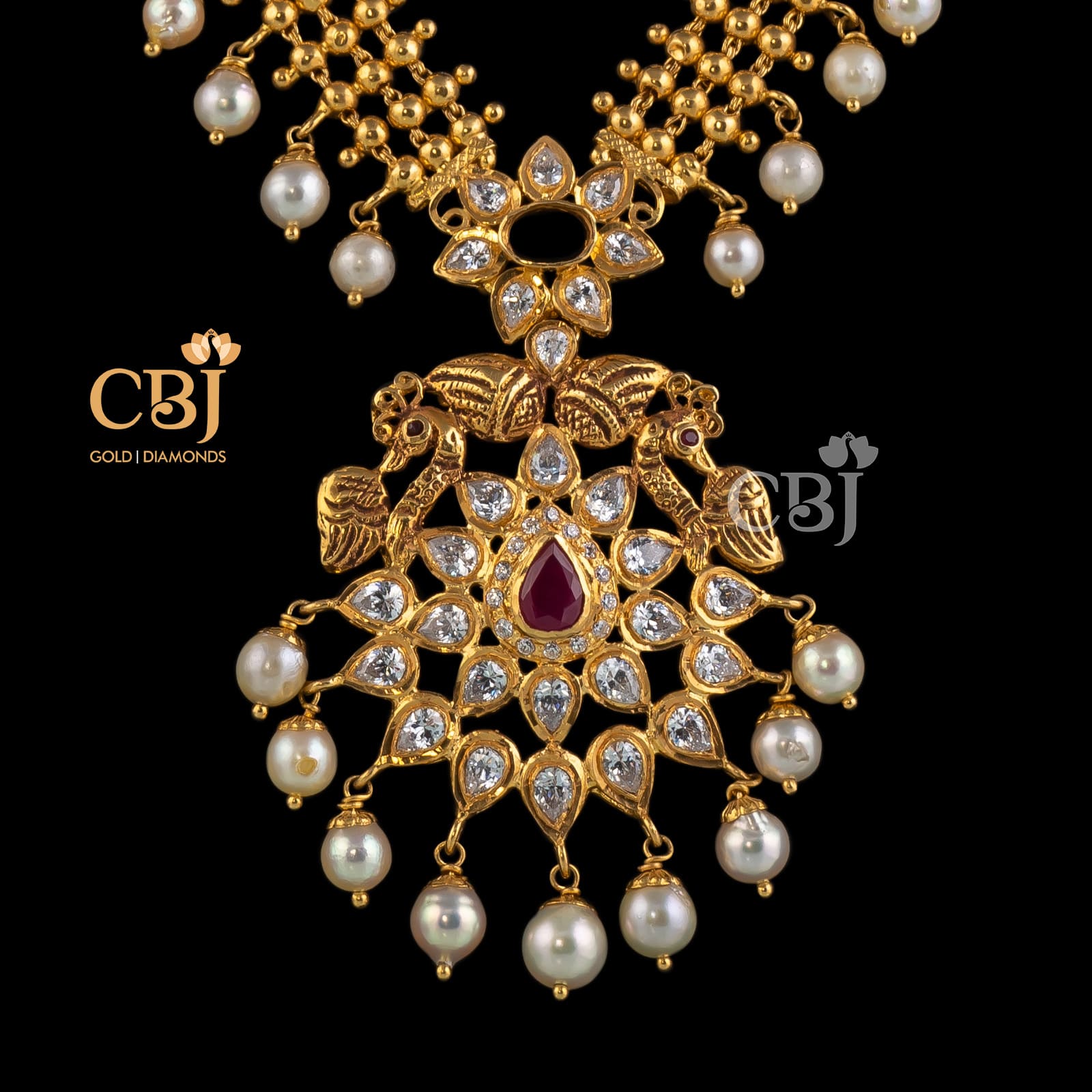 A special long necklace that highlights the CZ pachi workmanship; also featuring pearl drops.