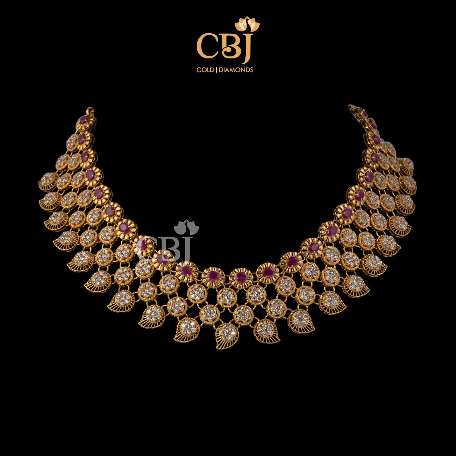 A flexible short necklace with mango motifs featuring rubies and CZ's assembled together in a unique fashion.