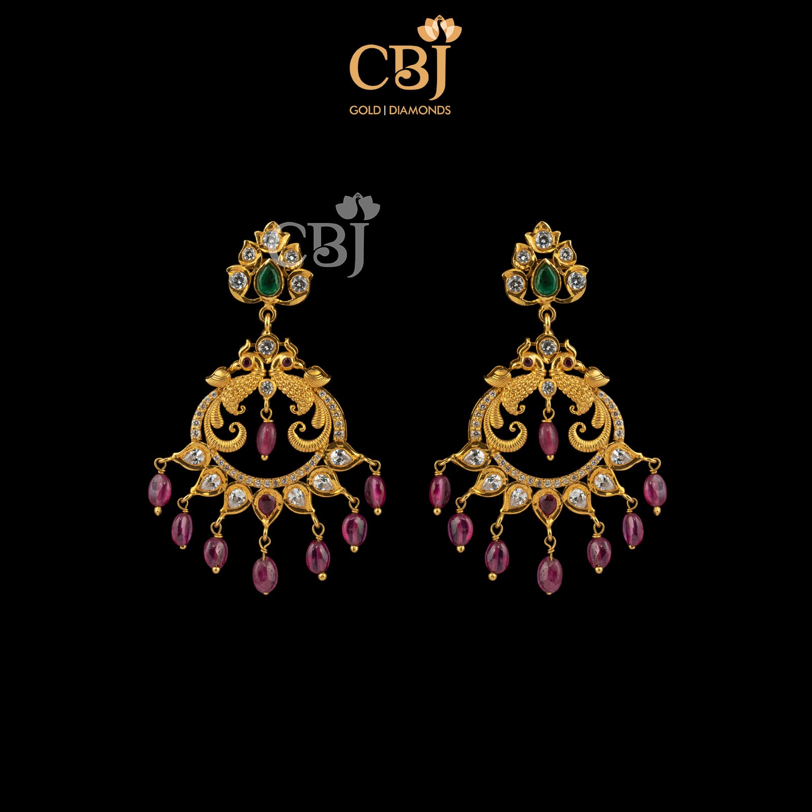 Ruby drops add a unique charm to these elegant chandbali's.