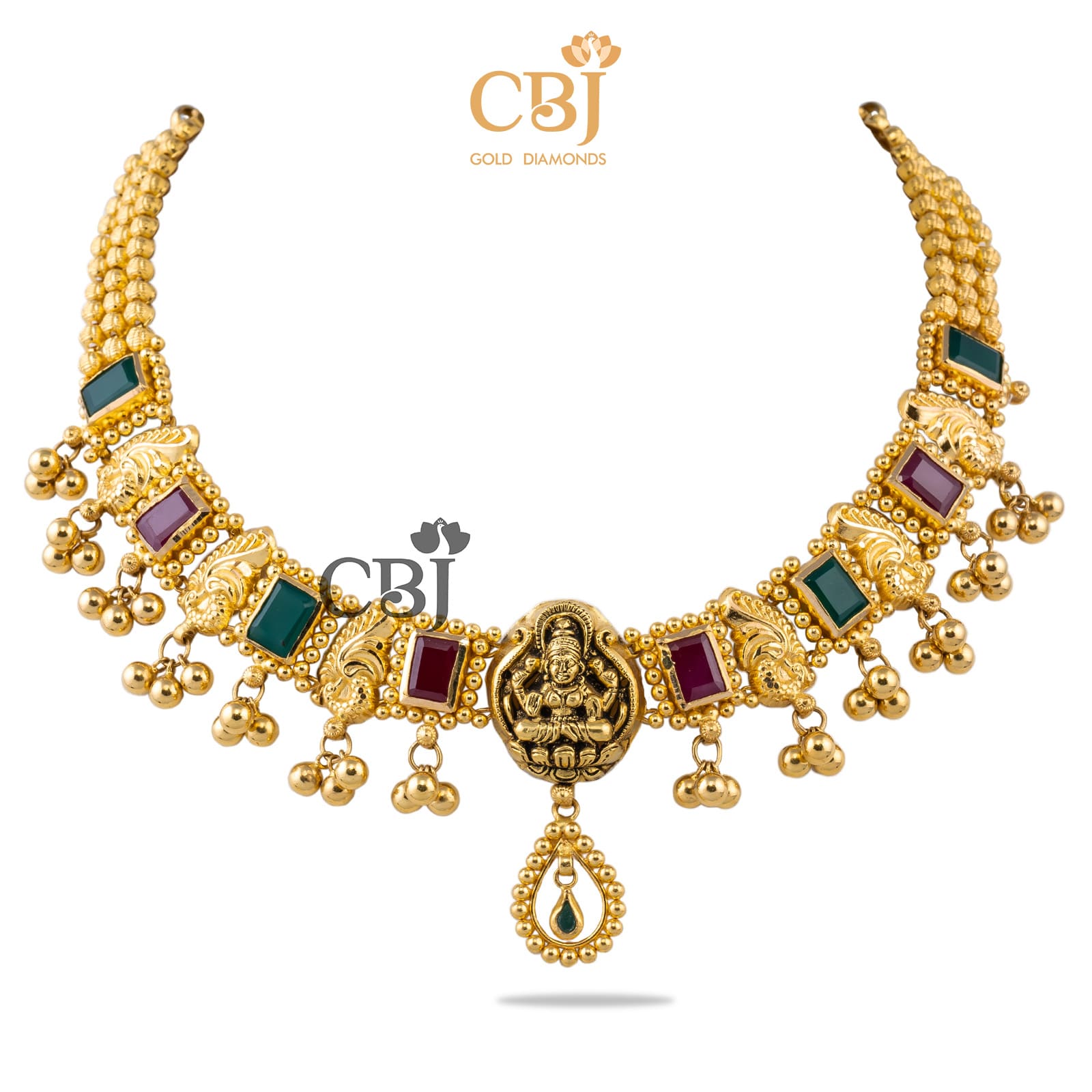 A short necklace highlighting the ruby and emerald stones, with an antique Lakshmi pendant.