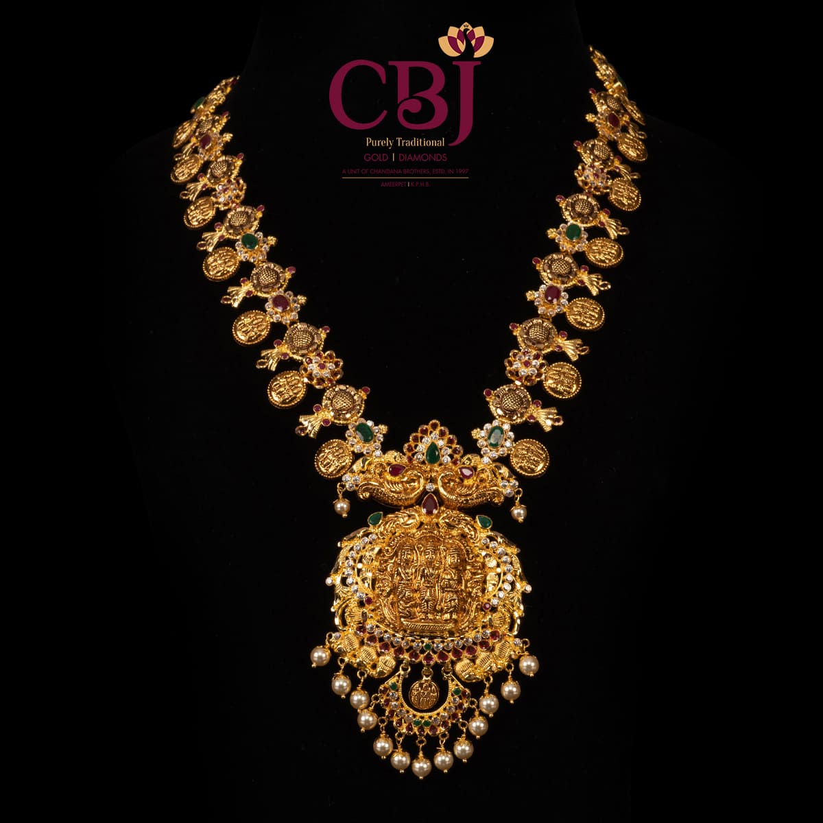 Light weight kasu mala decorated to perfection with ruby and emerald stones featuring Janaki Ram in the pendant.