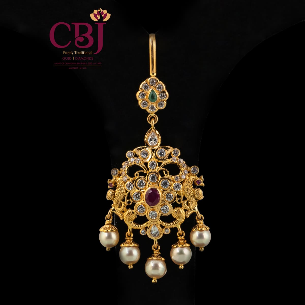 A royal and traditional maang tikka bejewelled with CZ stones for the glow.
