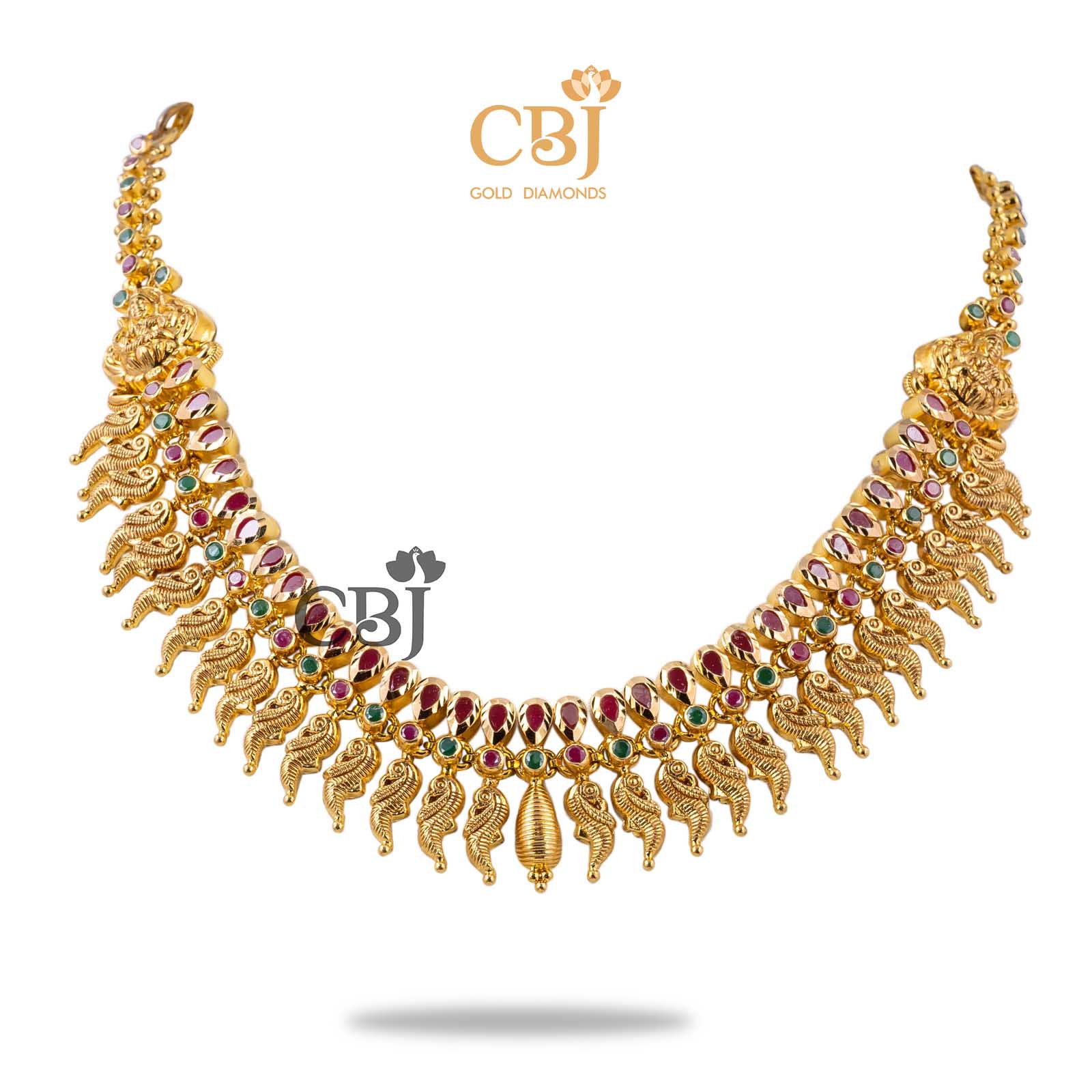 Rubies and emeralds perfectly aligned to the peacock drop design, to complete a perfect traditional look.