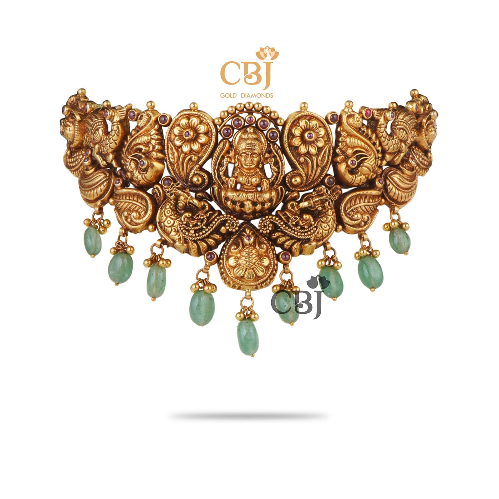 An antique choker featuring deep nakas work with suspended russian emerald drops adding to the beauty.