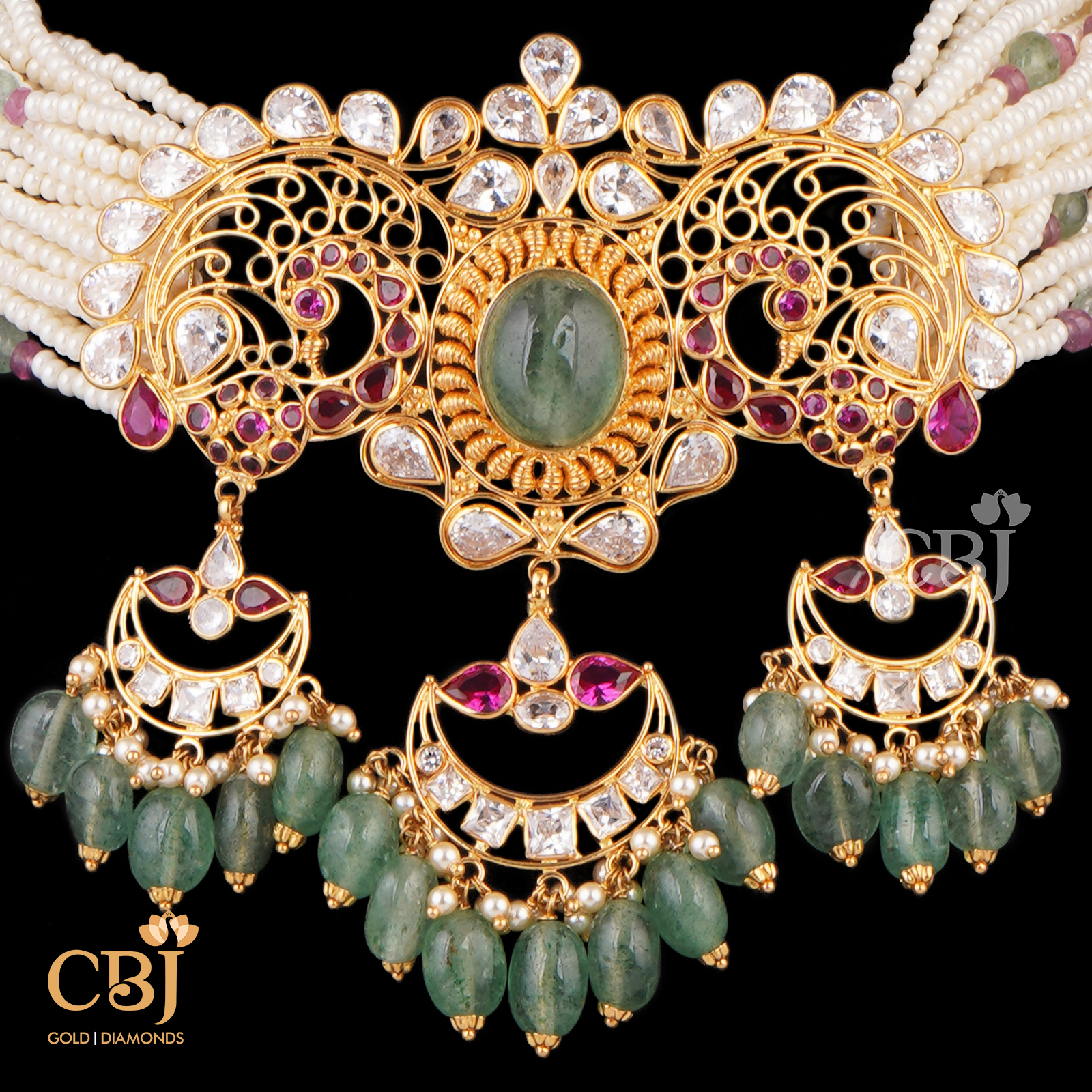 Pearls in this choker will illuminate your look. Russian Emeralds accompany them perfectly for a rich