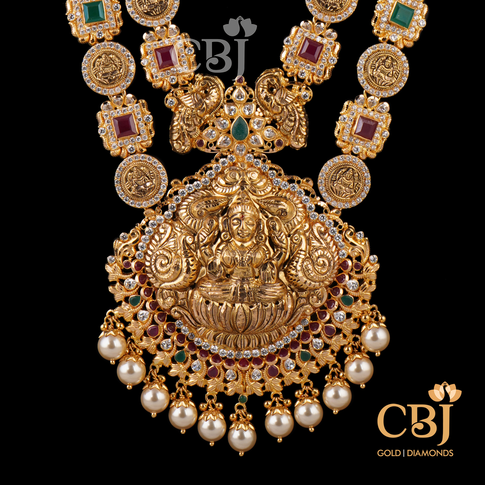A 2 step designer haram highlighting the emerald and ruby stones in perfect uniformity.