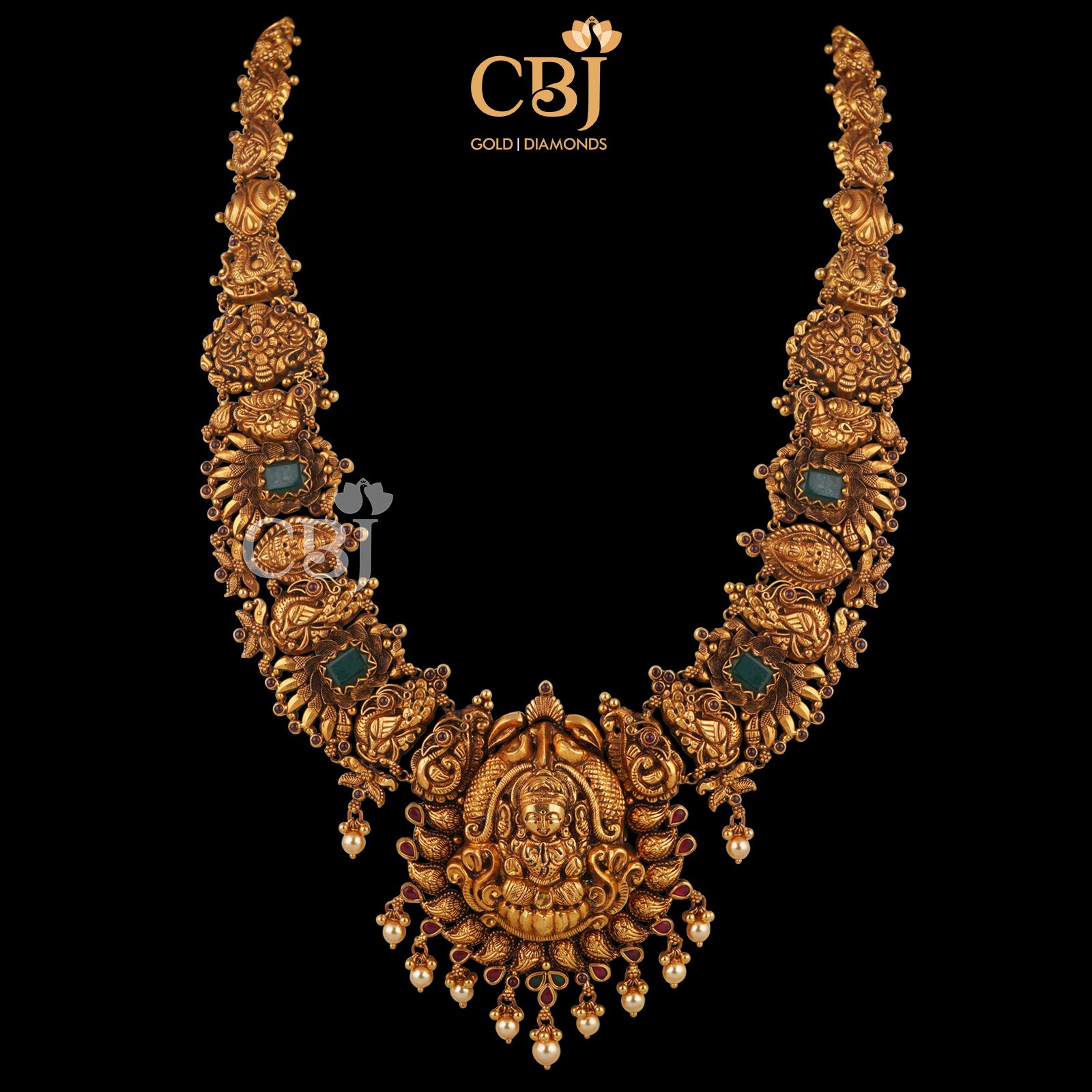 This antique semi long necklace depicts the excellence in our workmanship. A perfect blend of ruby, emerald and pearls in pure 22k gold.