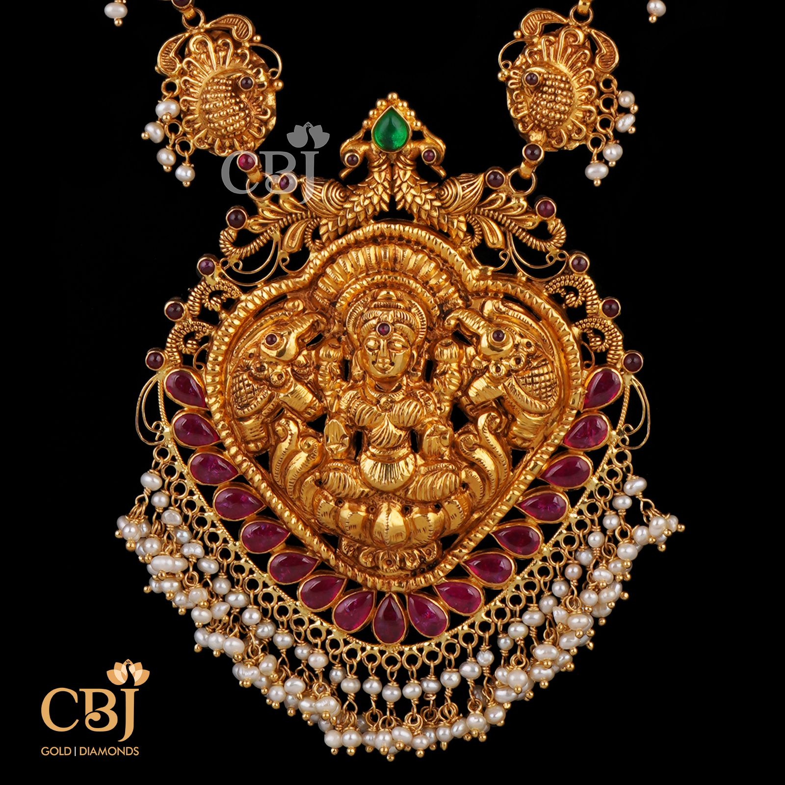 A divine deep nakas work featuring Devi in the centrepiece with suspended micro pearls.