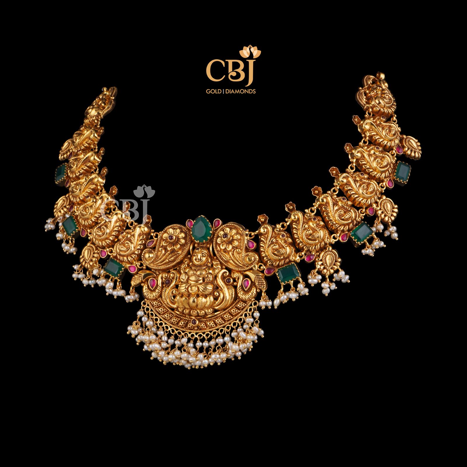 A traditional antique nakashi necklace studded with rubies and emeralds.