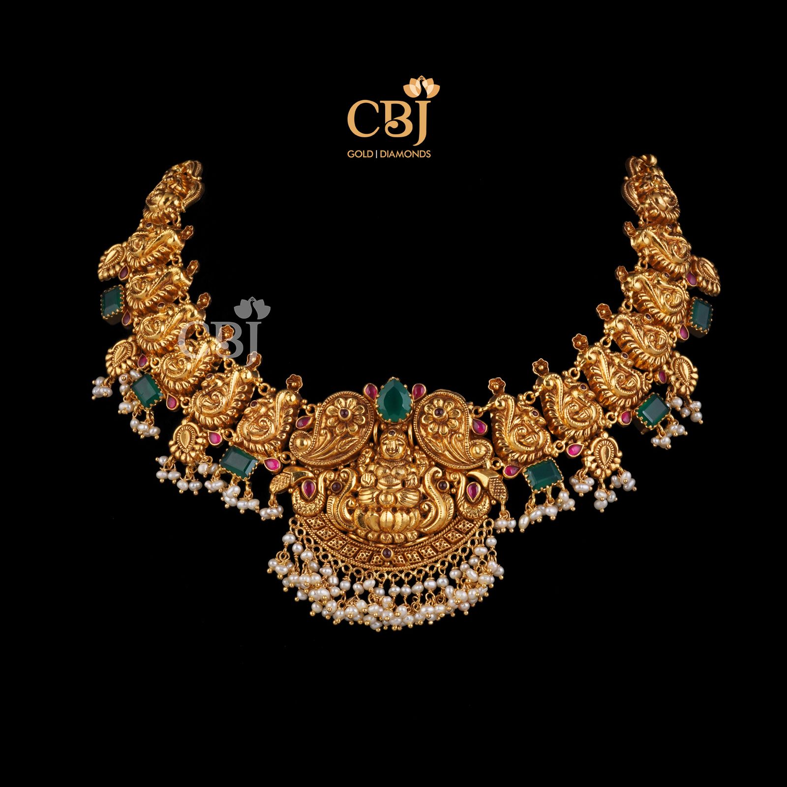 A traditional antique nakashi necklace studded with rubies and emeralds.