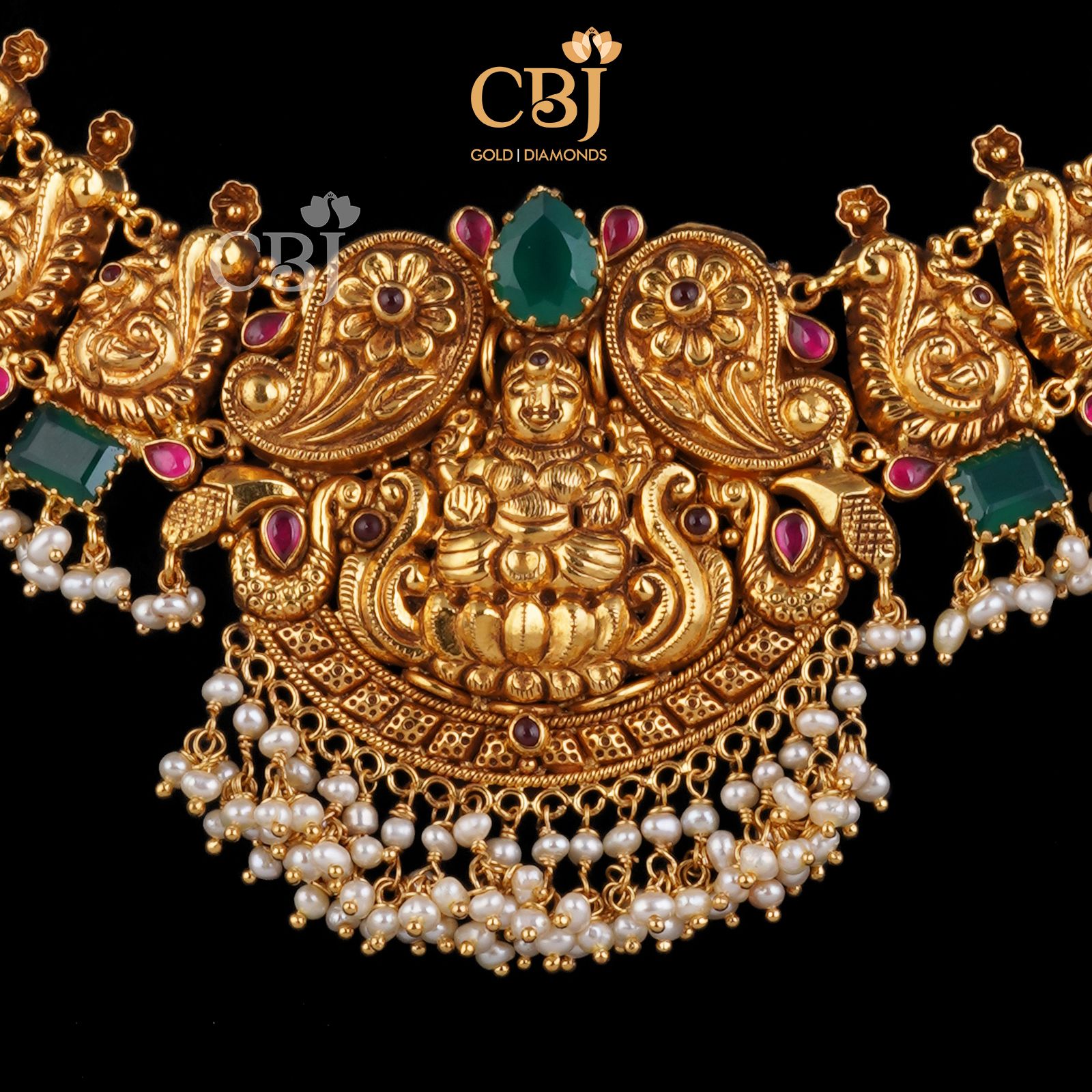 A traditional antique nakashi necklace studded with rubies and emeralds.