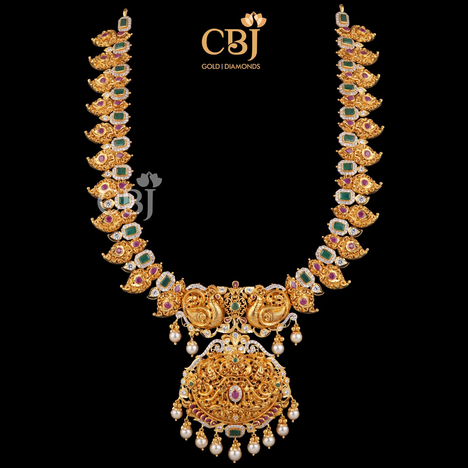 A mango U-haram featuring emeralds, rubies and pearls. 