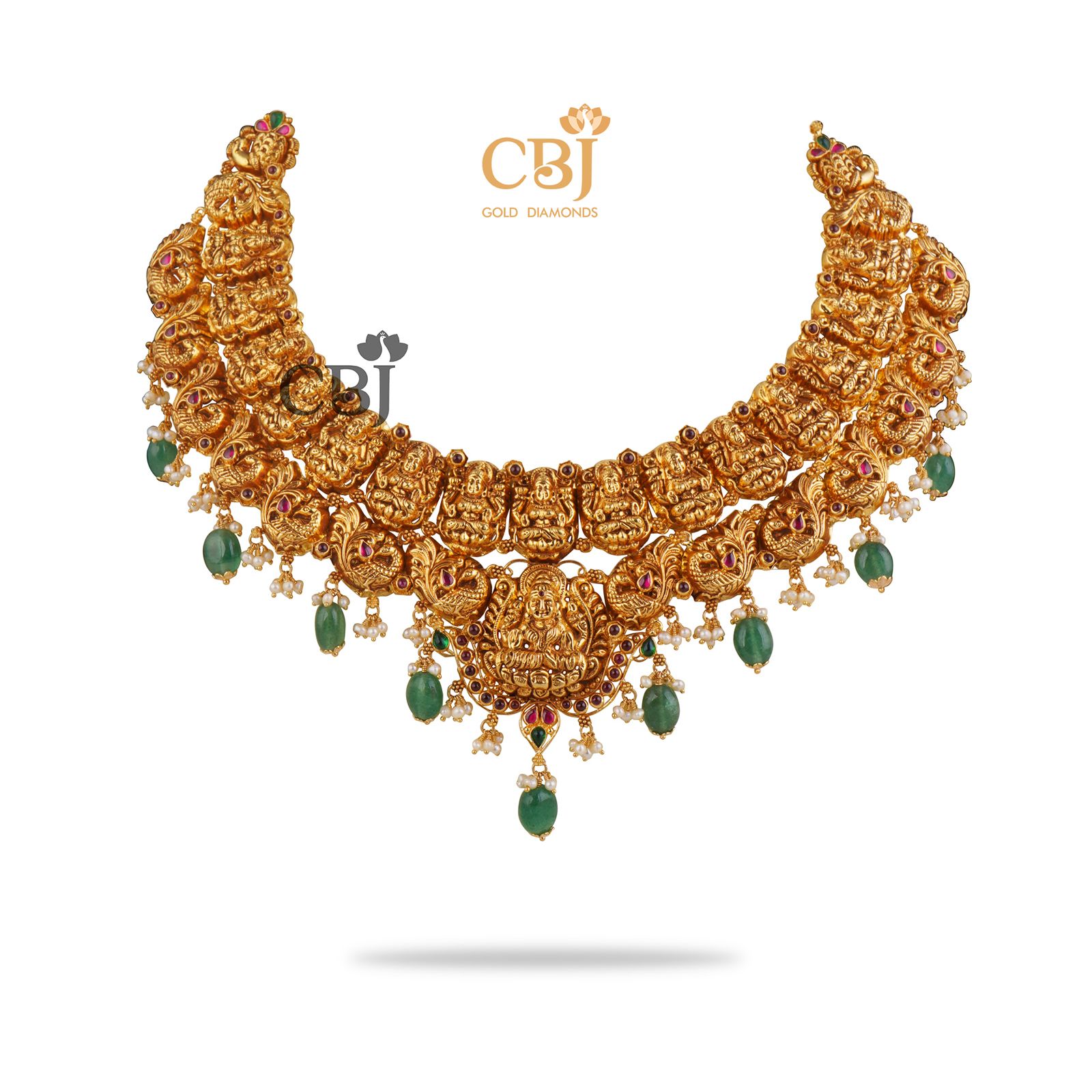 Pure 22k hold complimented by deep green hues. Nakashi necklace with Zambian emerald drops.
