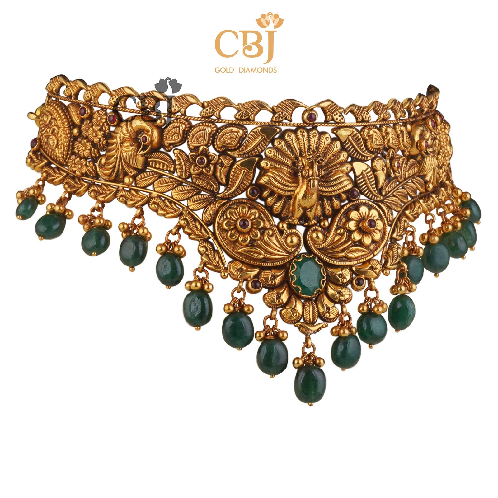 A perfect antique choker that can compliment your grace and elegance. An opulent design with suspended emerald drops.  Mayura Nakashi Choker with Emerald Drops.