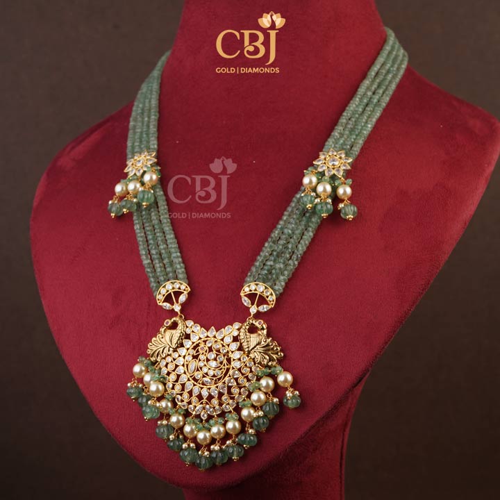 Ultra modern and an ultra light weight designer haar aesthetically enhanced with zambian emeralds.