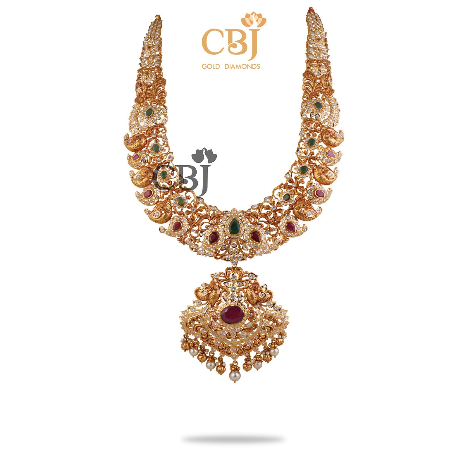 An amazing bridal designer U haram with mango motifs featuring ruby and CZ stones.