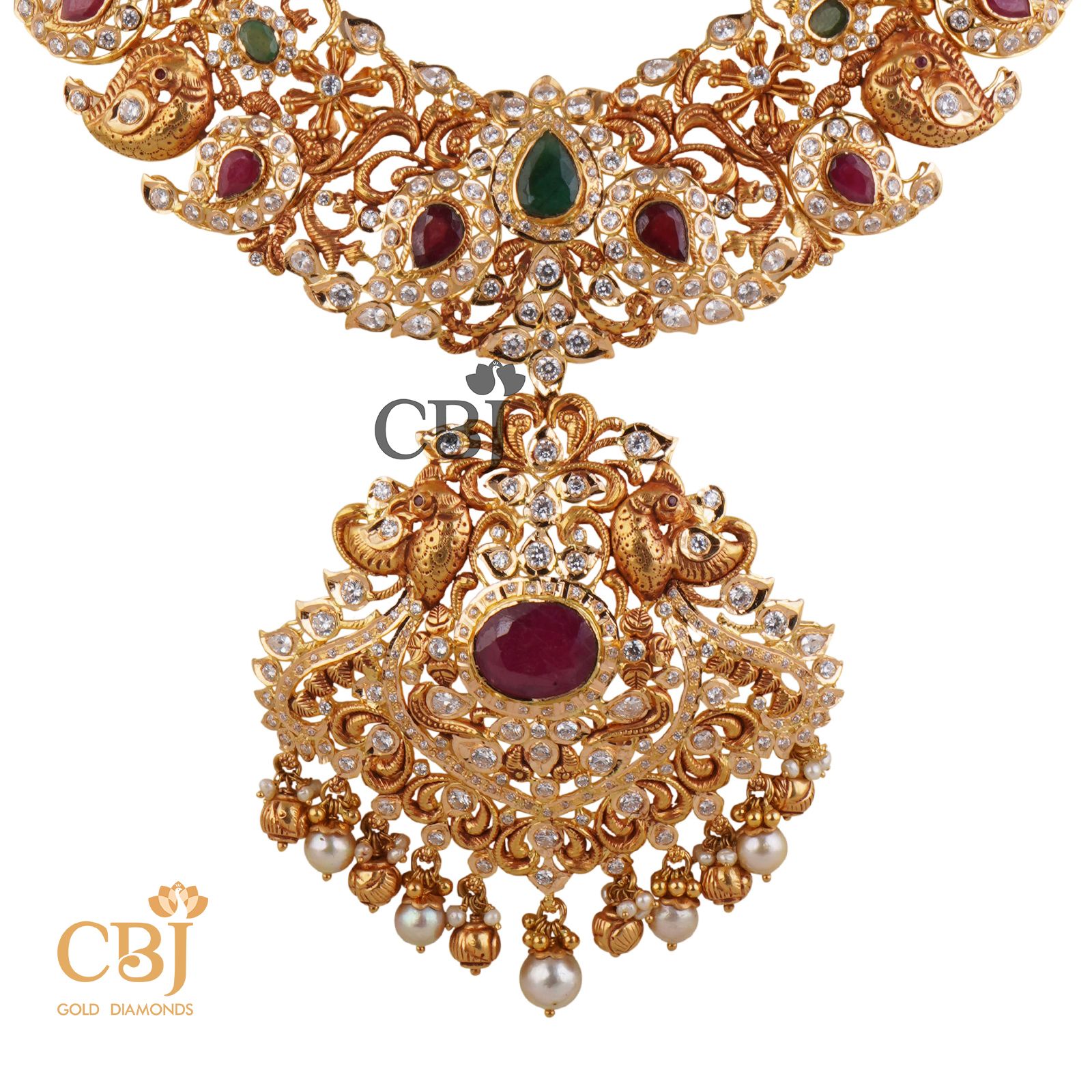 An amazing bridal designer U haram with mango motifs featuring ruby and CZ stones.