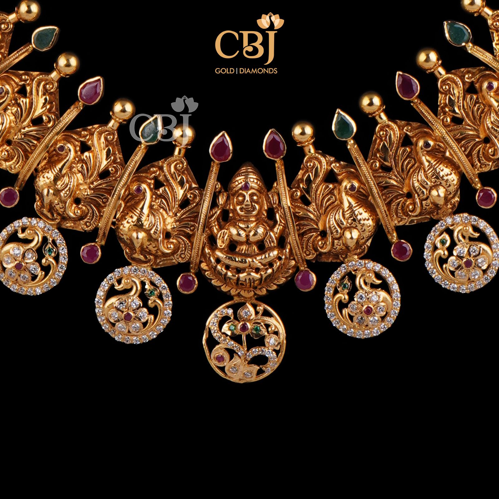A classic 22k gold bottumala bejewelled with ruby and emerald dots in a CZ pachi design.