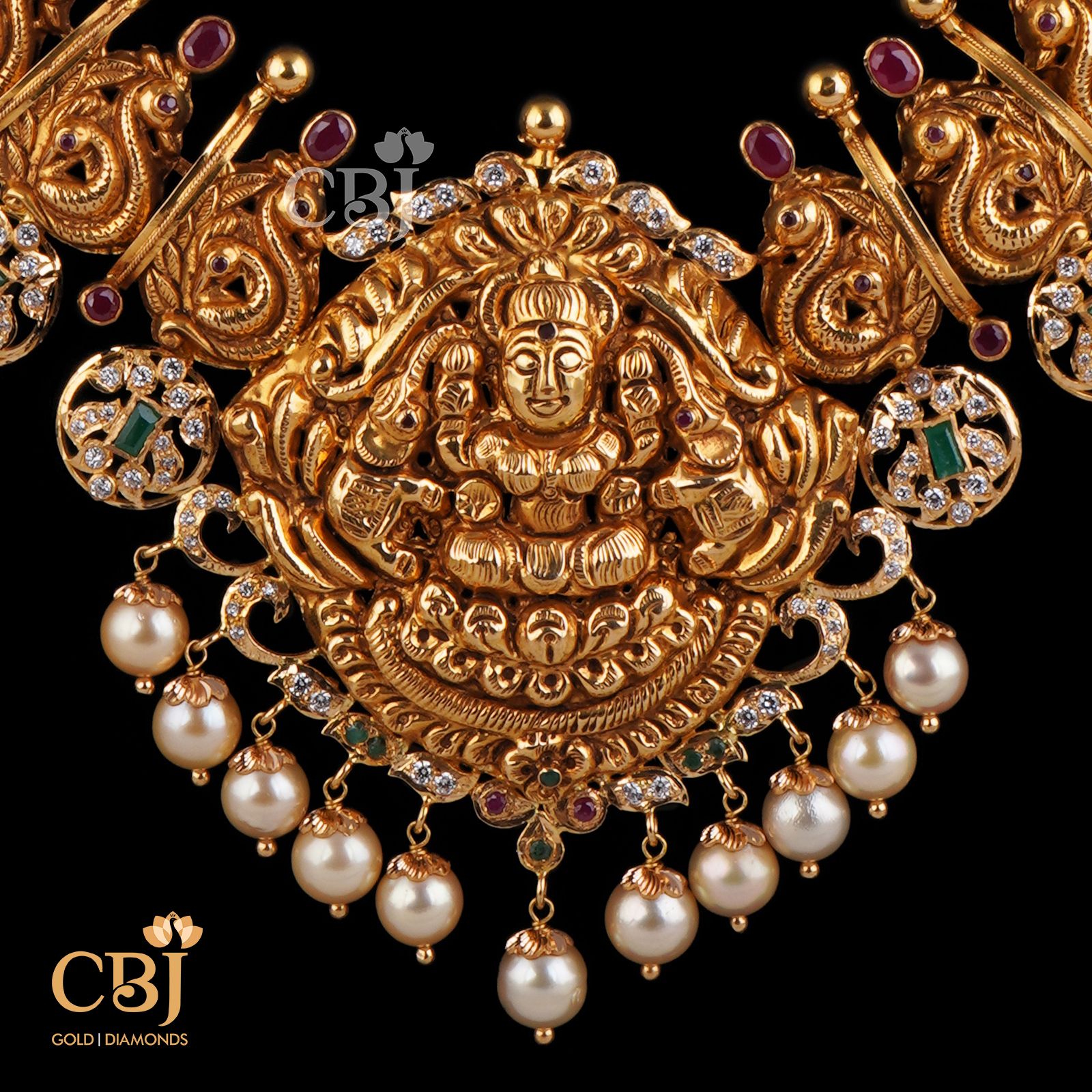 An antique bottumala design featuring rubies