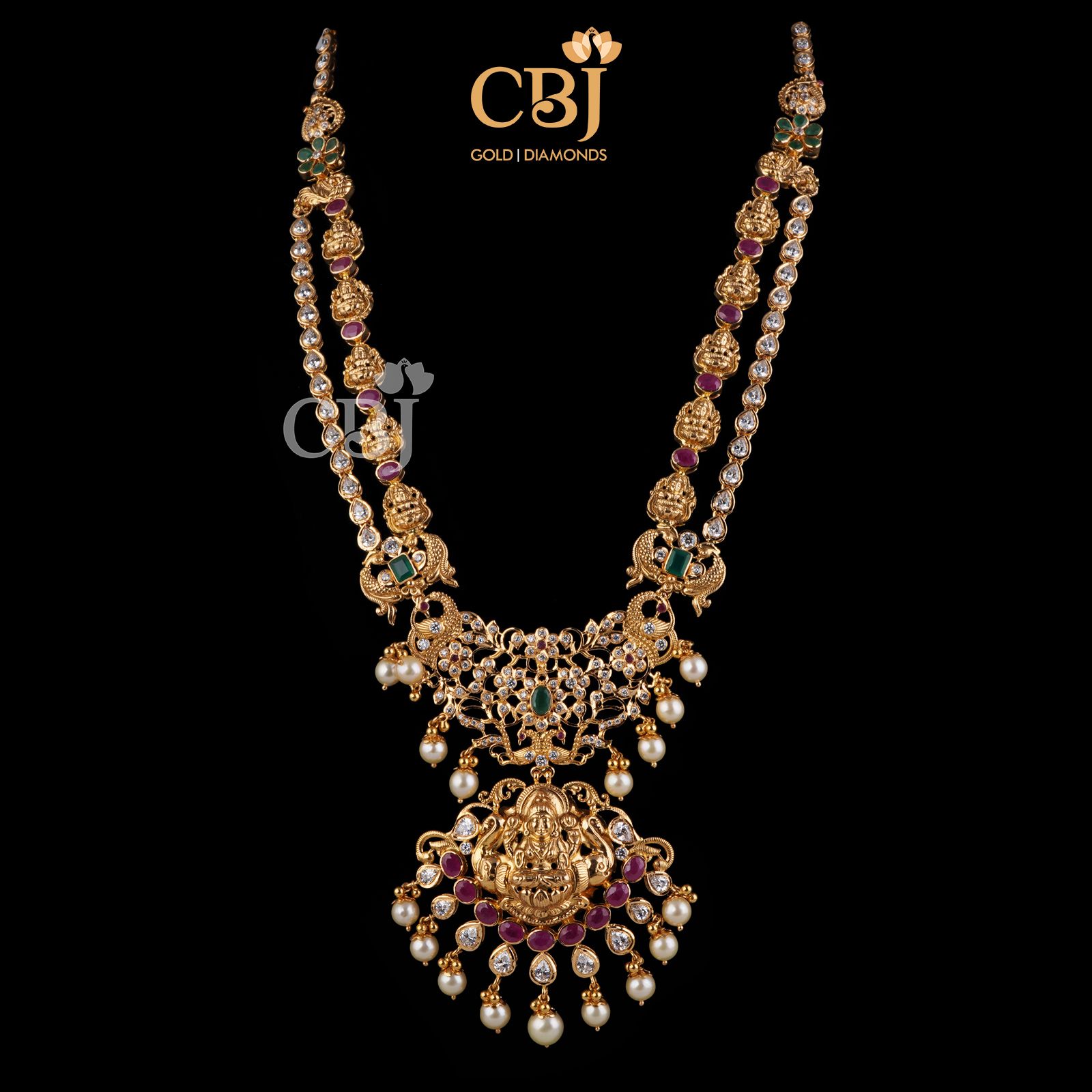 Get the might in light. A stunning mighty haram featuring rubies, pearls and emeralds in a light weight design.
