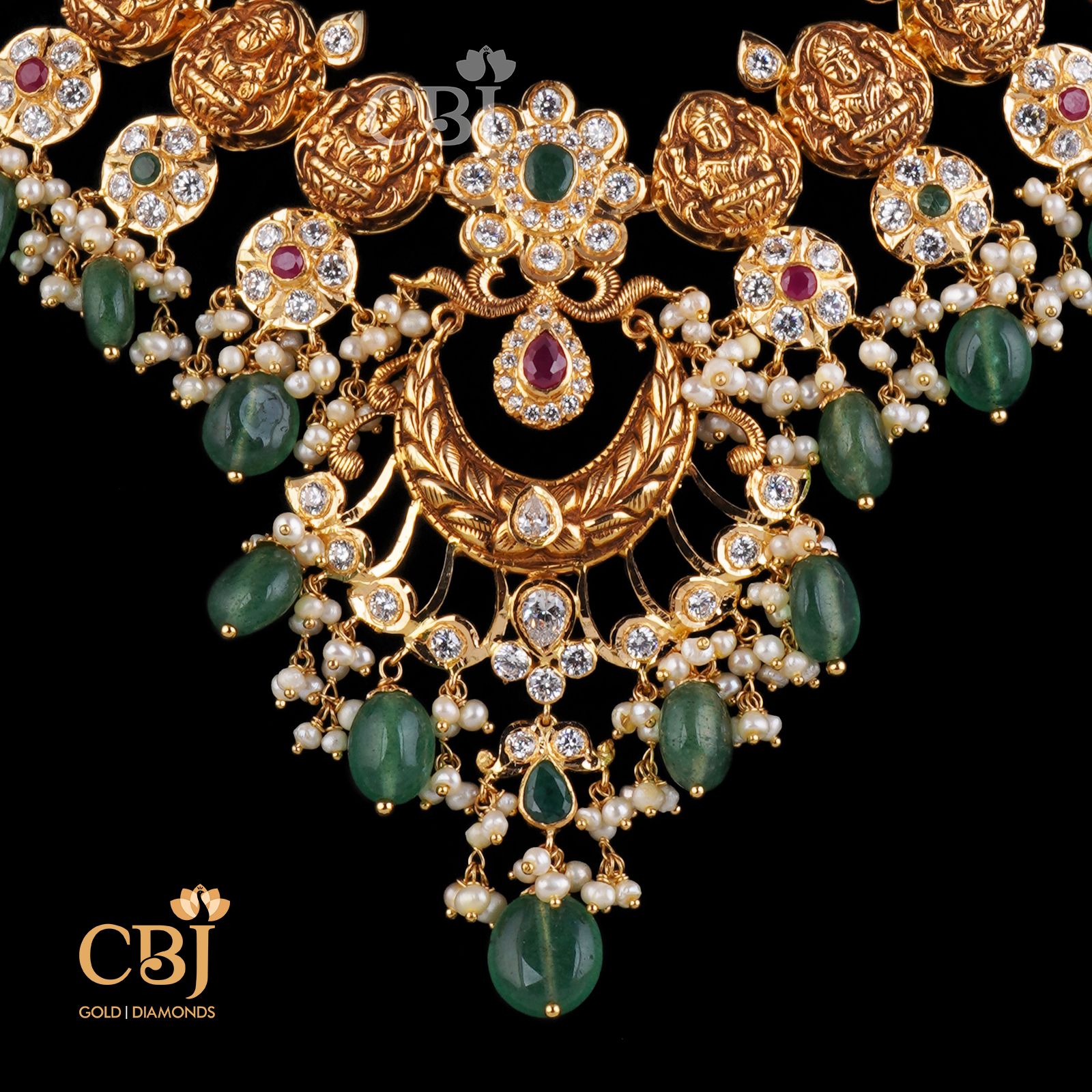 A divine Lakshmi Guttapusalu enhanced with gorgeous zambian emeralds. A unique classic/contemporary design.