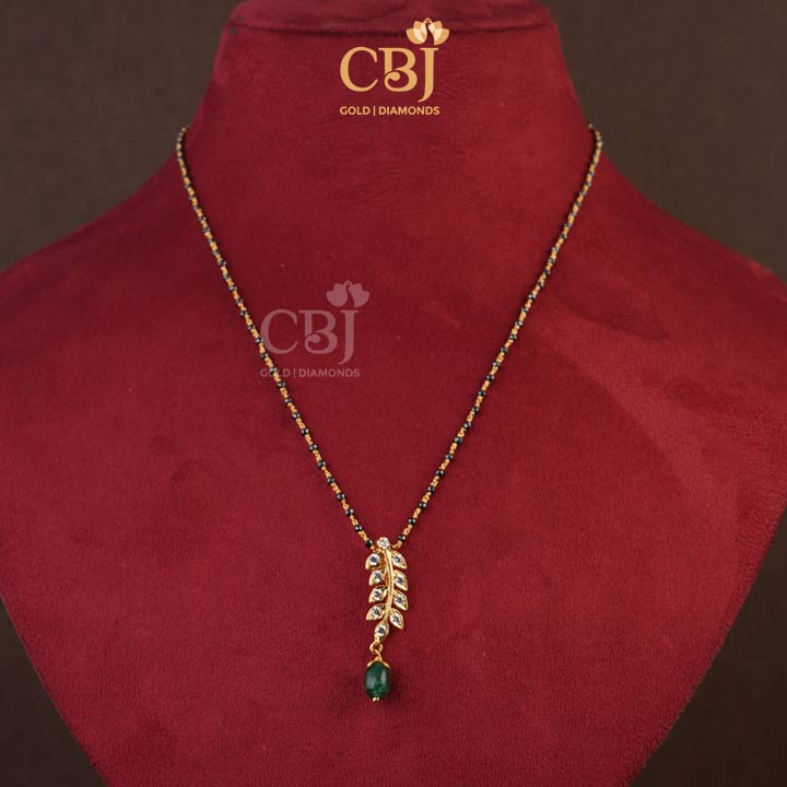 A mangalsutra design with a unique centrepiece designed like a leaf studded with CZ stones.