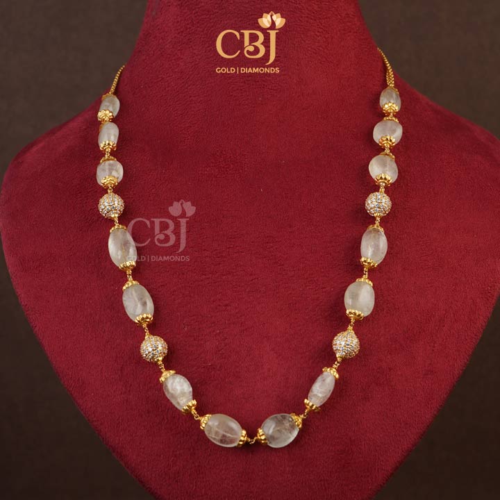 A stunning designer necklace aligned in tourmaline beads. Class in craft.