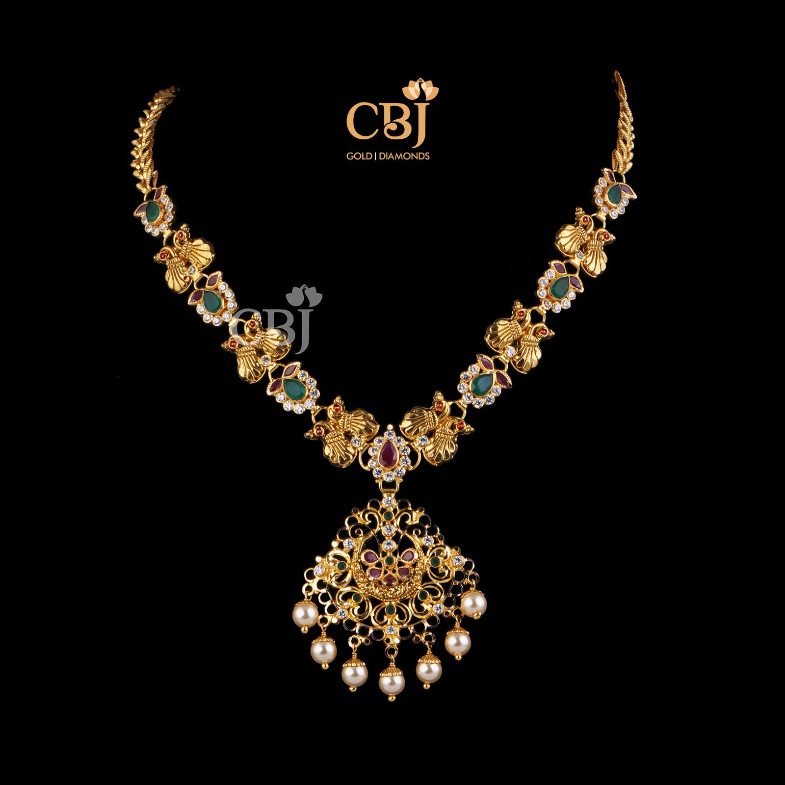 Petite light weight design featuring rubies and emeralds in its design.