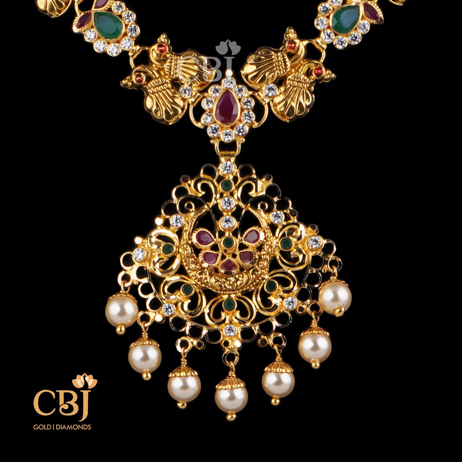 Petite light weight design featuring rubies and emeralds in its design.