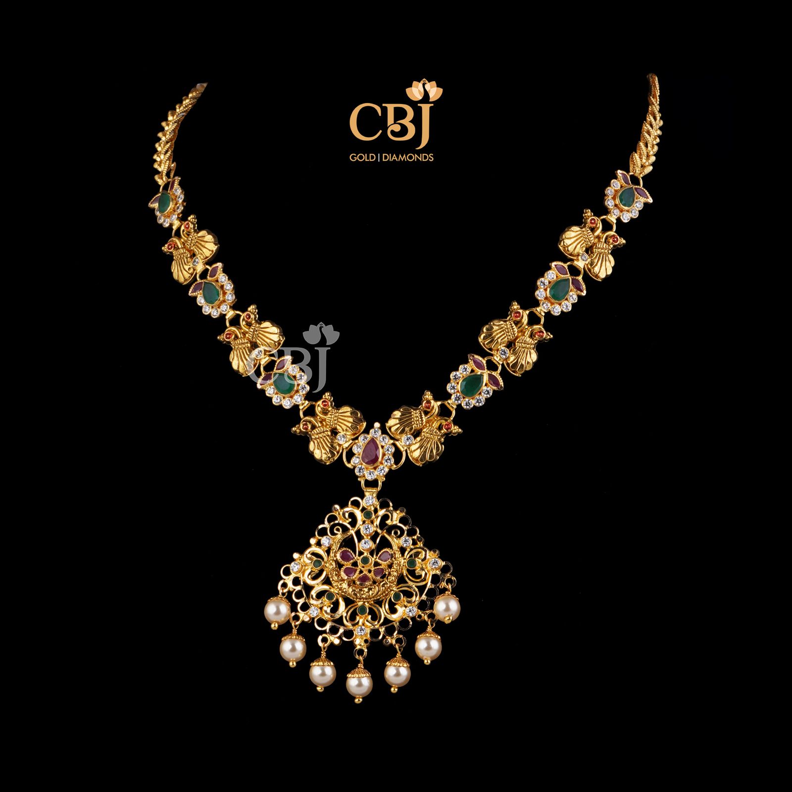 Petite light weight design featuring rubies and emeralds in its design.