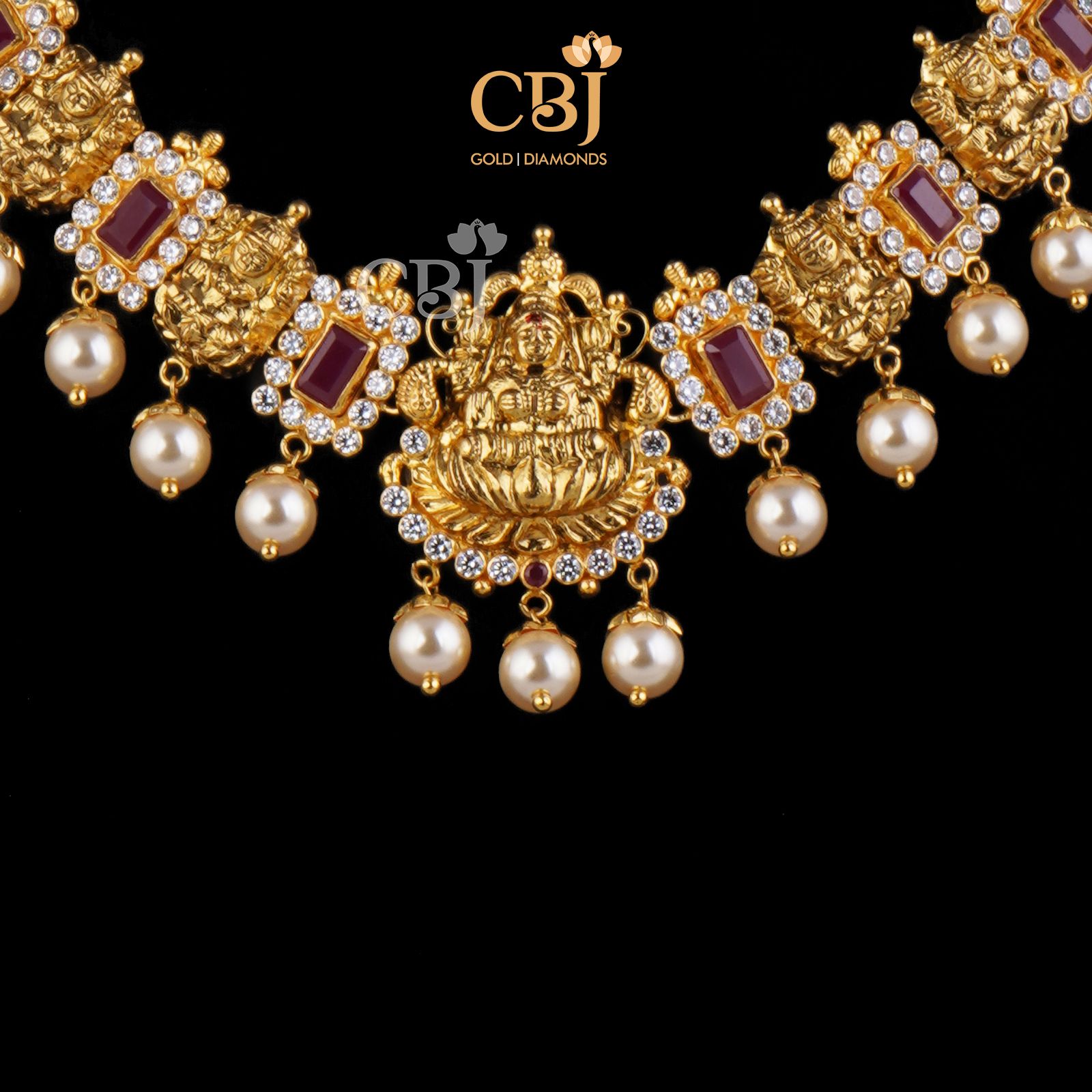 Perfectly petite necklace studded with ruby stones which compliment the 22k gold.
