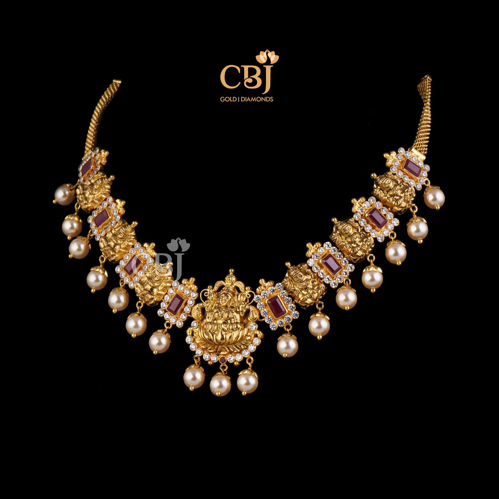 Perfectly petite necklace studded with ruby stones which compliment the 22k gold.