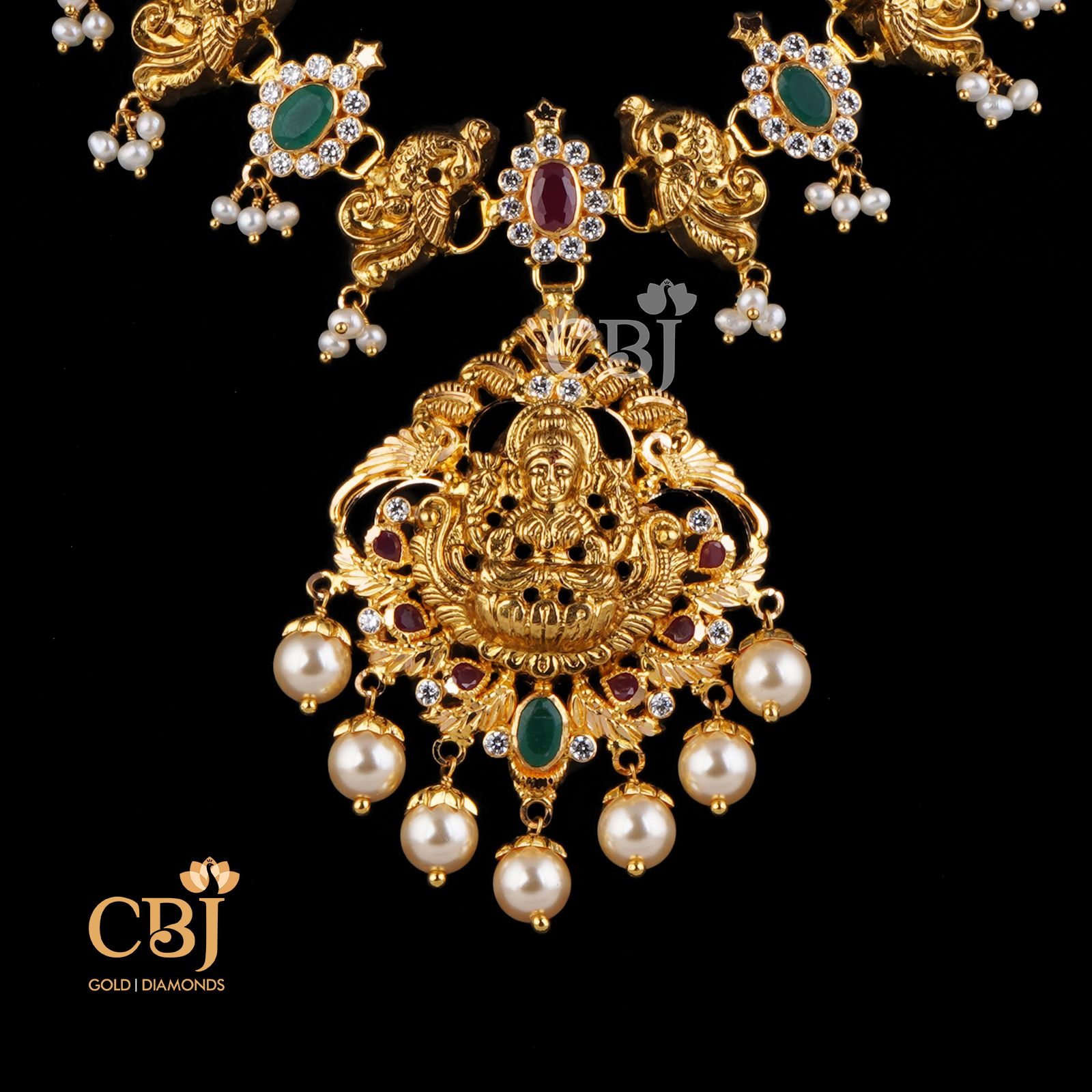 A short light weight necklace featuring rubies